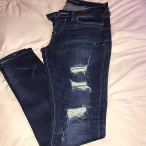Express distressed mid rise jean legging. Size 2R